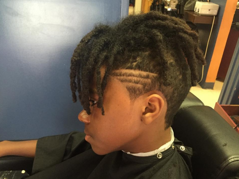 young man in a barber chair