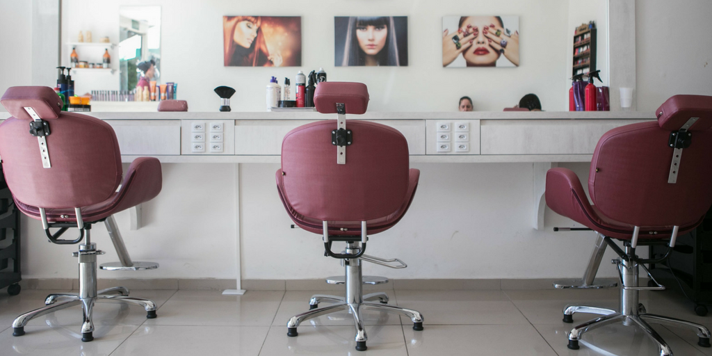 salon setup with chairs and mirror